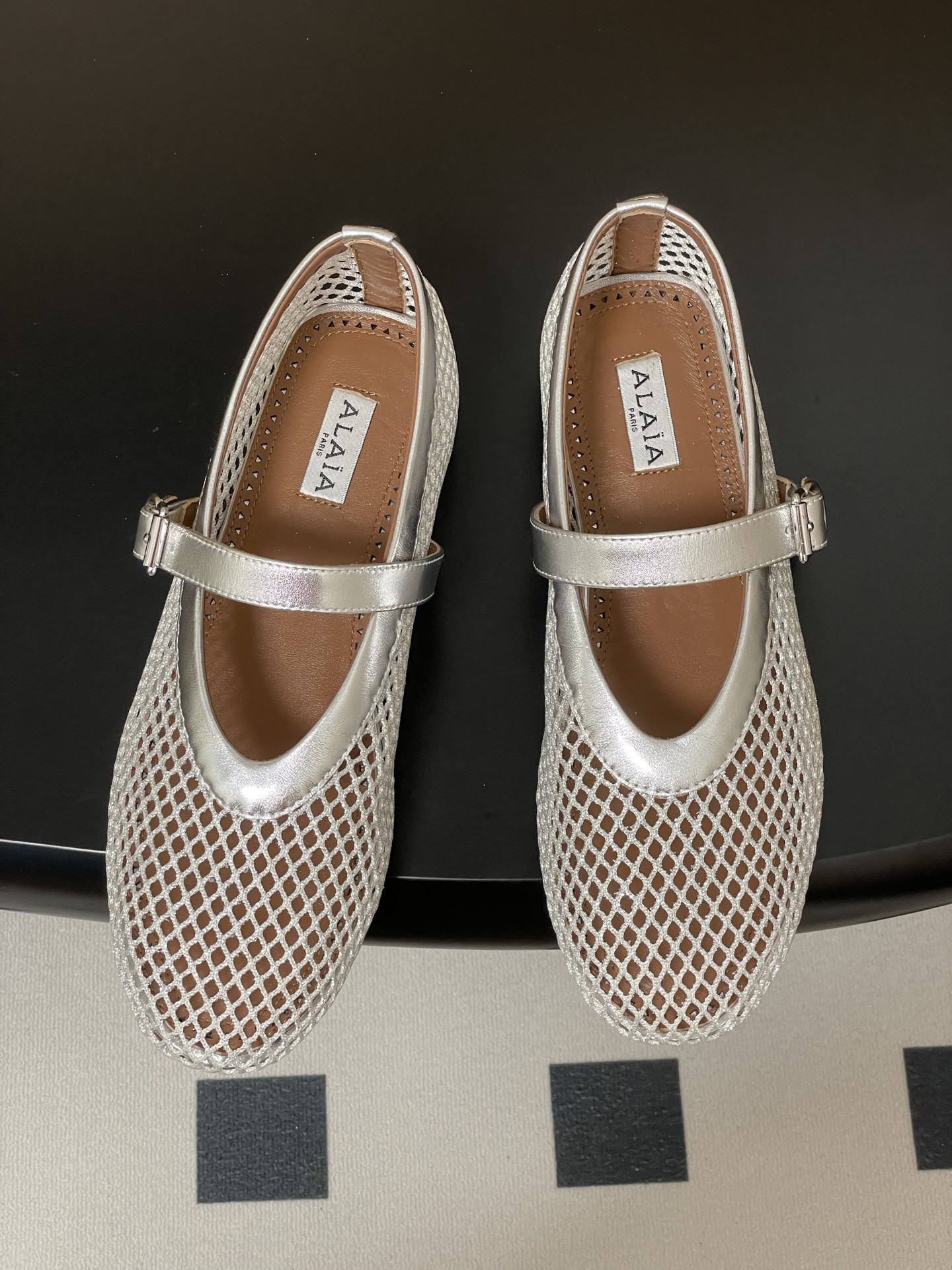 UA ALAÏA BALLET FLATS IN FISHNET